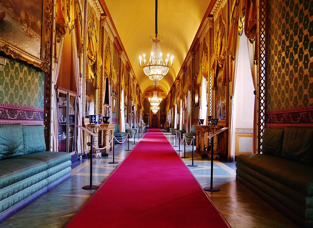 The Green Gallery with chandeliers and ornate green walls